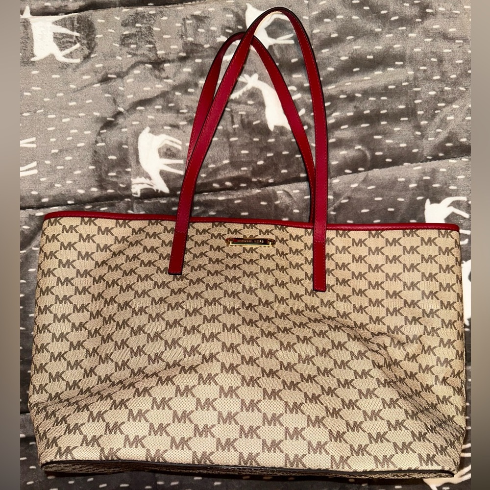 Red and tan Michael Kors tote bag